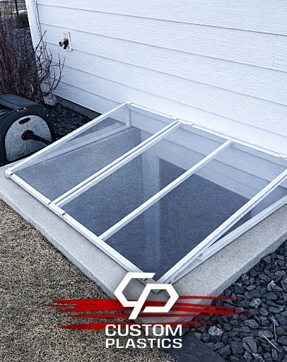 Aluminum Frame Window Well Covers sold by Custom Plastics of Fargo, North Dakota