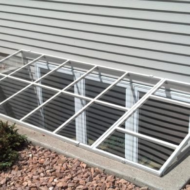 Custom Plastics - Aluminum Frame Window Well Cover in Concrete